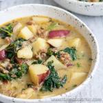 Cozy up to this Whole30 Zuppa Toscana (Dairy-Free Potato Soup Recipe) tonight! Packed with potatoes, sausage and fresh crunchy kale swimming in a lightly spiced broth, you'll think you're at Olive Garden (minus the guilt)! You'll fall in love with this healthy, dairy-free, gluten-free Olive Garden Zuppa Toscana copycat recipe once you give it a try.