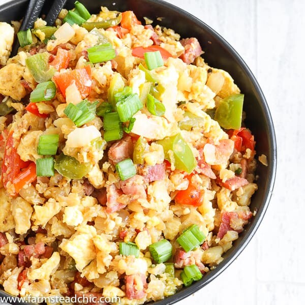 With this Low Carb, Keto Ham Fried Rice (Fried Cauliflower Rice), you can have your takeout and stay low carb too! Freshly riced cauliflower replaces traditional rice, and bell peppers add sweet and savory flavors plus crunch without all the carbs the usual takeout fried rice veggies have. Freshly grated ginger and minced garlic take the whole dish to the next level.ย #farmsteadchic #CliftyFarm #countryham #southerncooking #ketofriedrice #lowcarbfriedrice #hamfriedrice