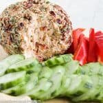 This Low Carb, Keto Pineapple Ham Cheese Ball is a guilt-free, flavorful appetizer for your holiday party. Freshly cooked country ham, toasted coconut, monk fruit, pineapple extract, roasted red peppers, chives, freshly shredded cheddar cheese and hot sauce all come together for a salty, sweet, spicy (low carb) spin on a traditional Hawaiian cheese ball. #farmsteadchic #cliftyfarm #ketocheeseball #lowcarbcheeseball #ketoappetizer #lowcarbappetizer